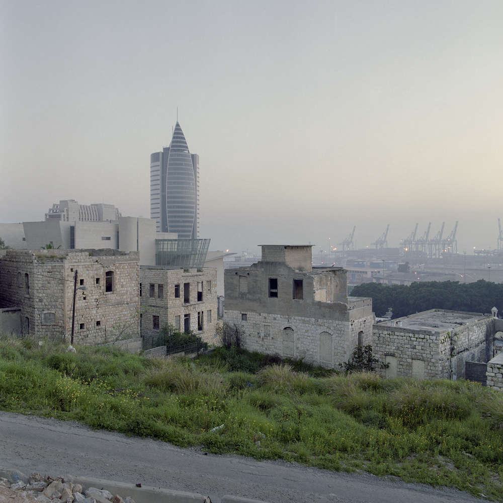 Haifa 32°48’40”N 35°0’0” E – 04.1948 Abandoned houses seen in the Wadi Salib neighborhood of Haifa. Most of the inhabitants of Wadi Salib left or were evicted by Zionist forces during the “Passover Cleaning” operation (Bi’ur Hametz) in April 1948. After the 1948 War, Moroccan Jewish immigrants were housed in the vacant houses of Wadi Salib. In 1959, they rebelled against Israeli authorities to demand better housing. Photo by Bruno Fert.