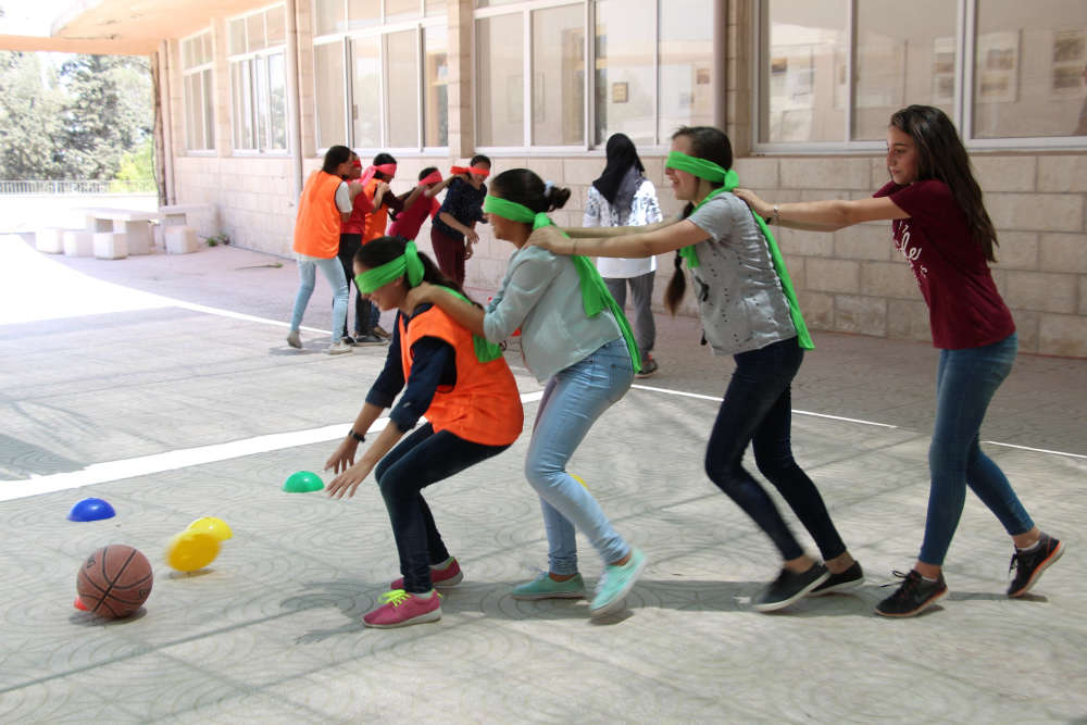 Girls at a summer camp organized by PS4L in East Jerusalem to practice life and employability skills. Photo by Amani Awartani.