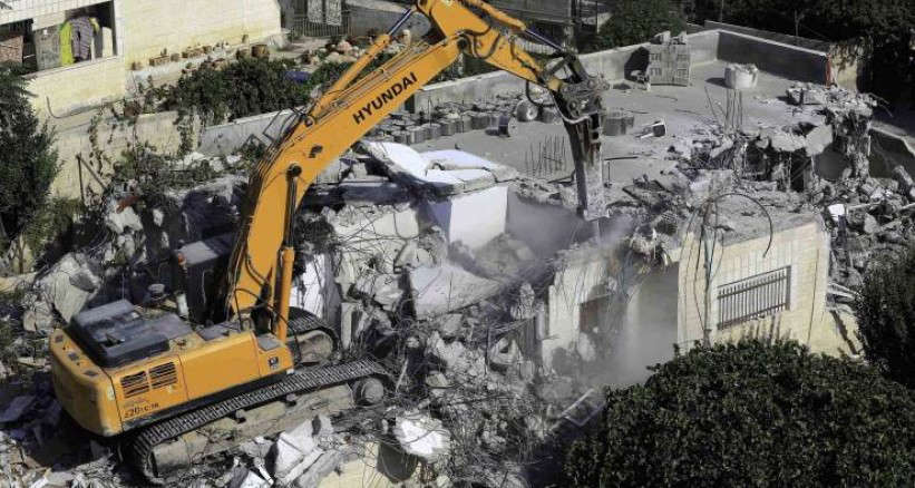 A house in northern Jerusalem being demolished because it lacks the necessary construction permit. According to the Israeli land-planning and zoning system, 87 percent of Jerusalem is off-limits to Palestinians, forcing them to build without proper construction permits.