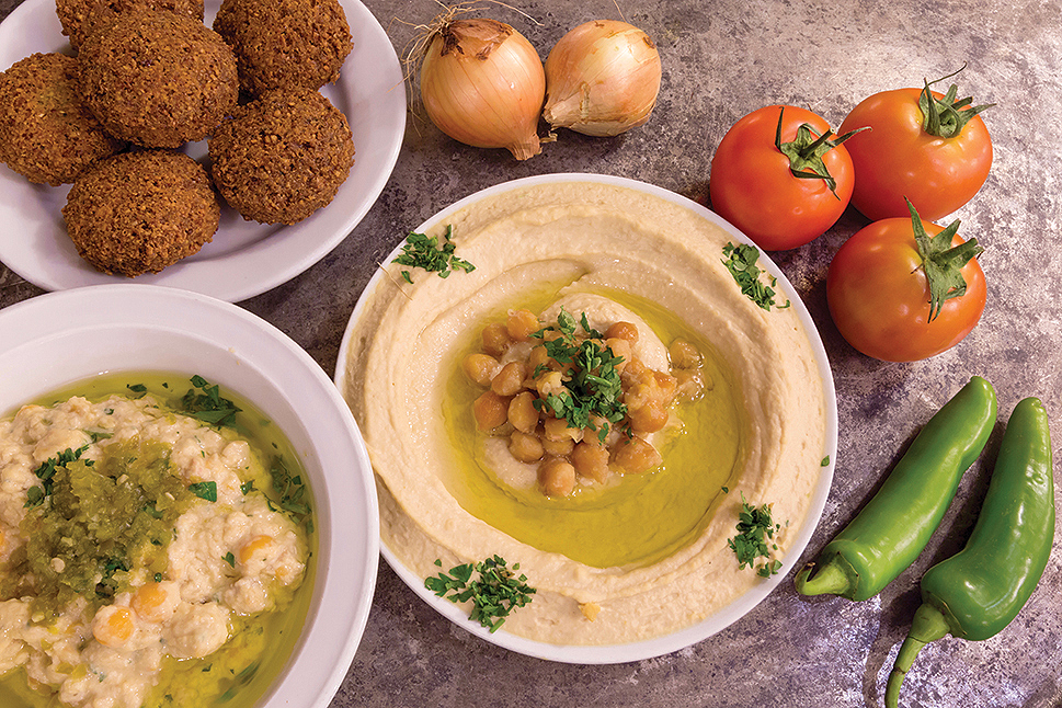 Palestinian traditional cuisine includes falafel, hummus, and fatteh. Photo by Elias Halabi.