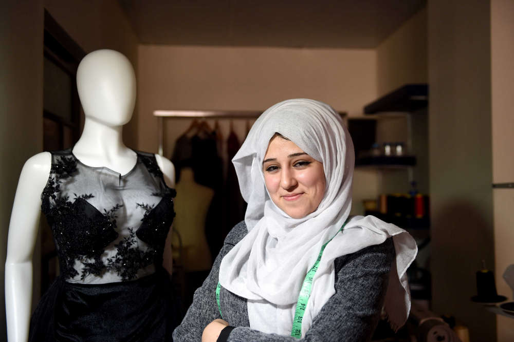 Maha from Gaza owns her own project, designing and marketing dresses for weddings and special occasions. She established her business through Maharat, an economic empowerment programme, funded by the Islamic Development Bank, which is based on building the capacities of youth in the areas of administration, finance, and project management and technical skills, and linking them with the industrial job market. © UNDP/PAPP - Shareef Sarhan