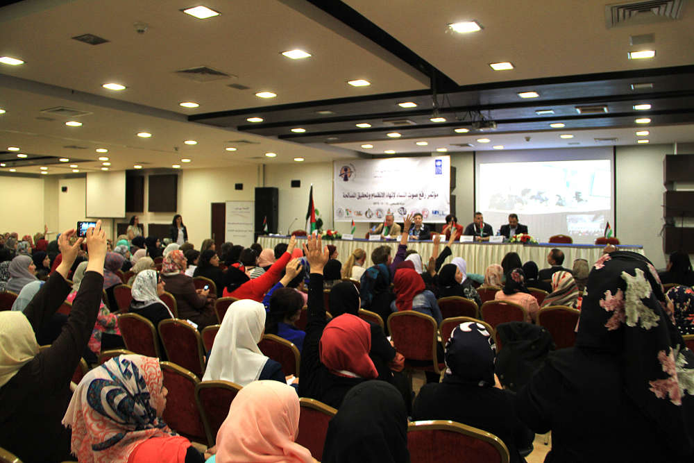 Participants in the conference titled Women’s Call: One Country, One People, One Flag that was organized by MIFTAH and other civil society organizations on 15 June 2015. It was held in Ramallah and Gaza simultaneously, communicating via video conferencing. Photo courtesy of MIFTAH.