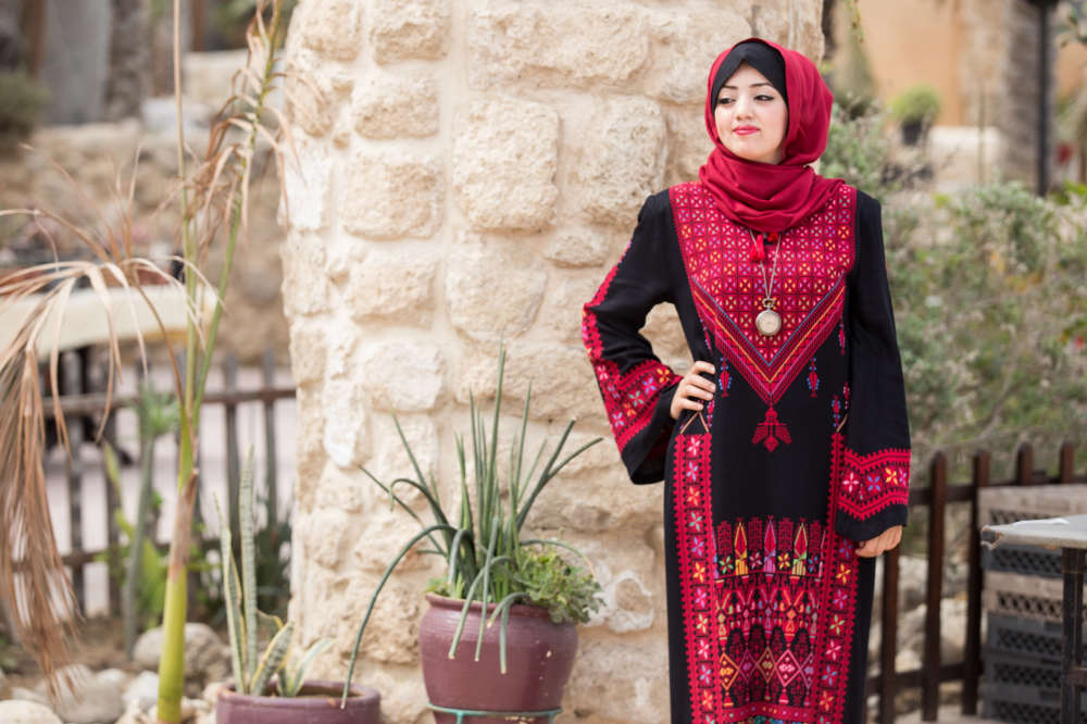 Dress, Kohl Holder with Roses and Hijabs (Makhaleh bi Ward). Madani cushion cover, Small Colorful Roses design. Photo credit: Tamer Hamam, UNRWA, 2017.